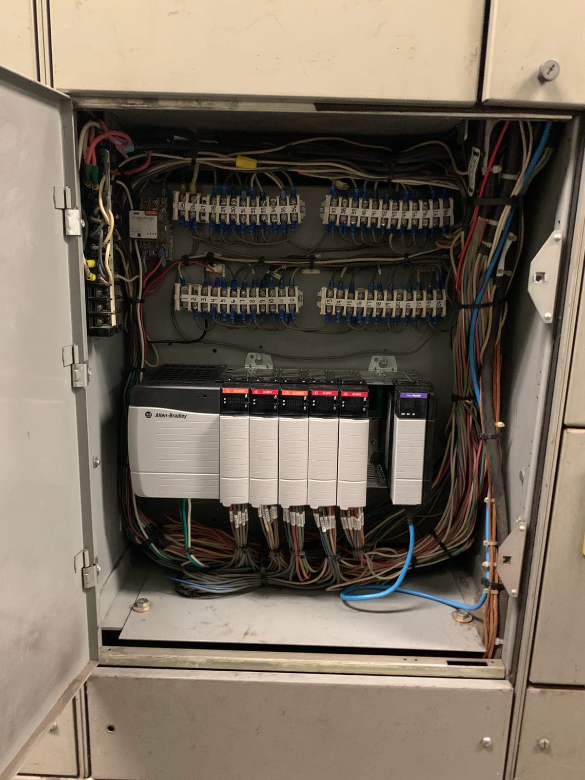 Upgraded Allen-Bradley PLC control system installed by Electrisource with labeled wiring